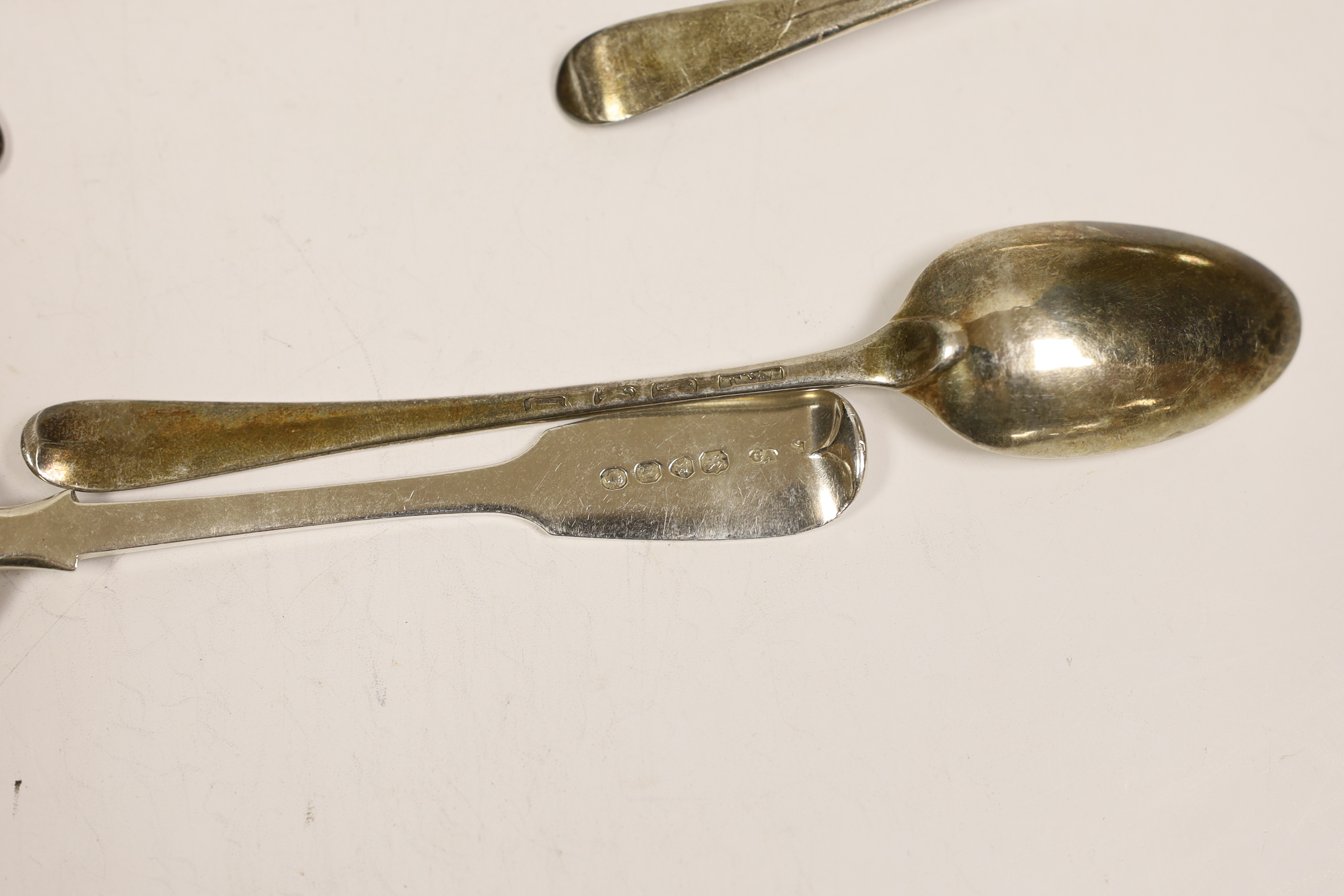 A set of five George III silver Old English pattern dessert spoons, George Smith III, London, 1776 and one other similar spoon, a matched et of six 18th century silver Hanovarian pattern dessert spoons and eight 19th cen